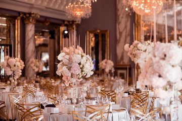 Event designer arranging furniture and decor to create a seamless, immersive wedding experience.