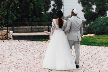 Close-up of a ketubah signing ceremony at a Jewish wedding, symbolizing cultural and spiritual traditions.
