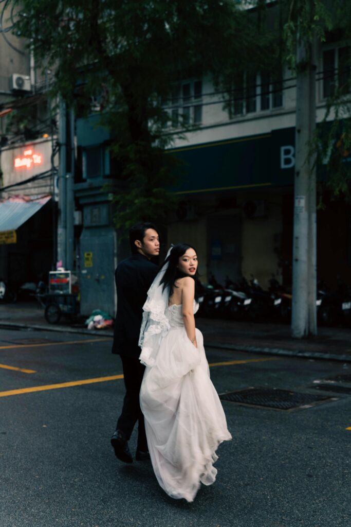 Bride and groom share a candid moment on their wedding day, captured by a wedding cinematographer.