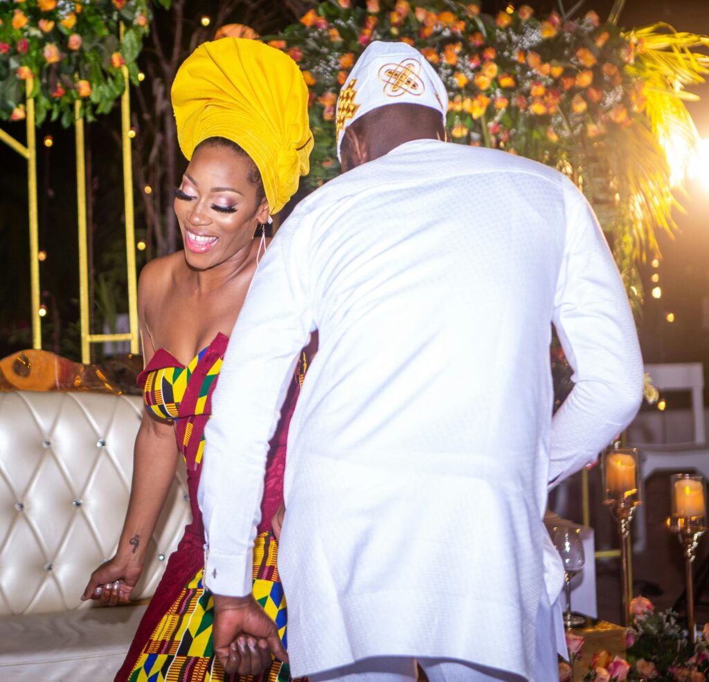 Elegant wedding decor featuring floral arrangements, candles, and textiles that reflect the couple's multicultural backgrounds